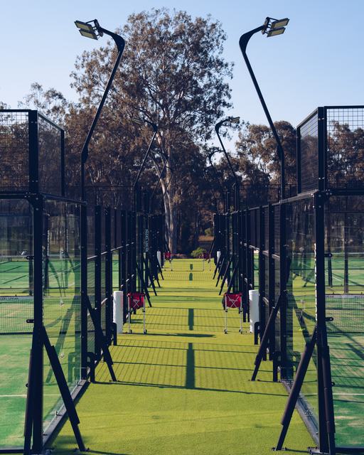 Looking down the row of four padel courts at Padel Logan